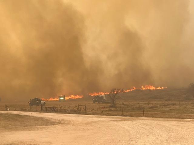 Firefighters fight a wildfire north of Miami, Texas, at Hale Cattle Company. (Photo courtesy of Jett Hale)