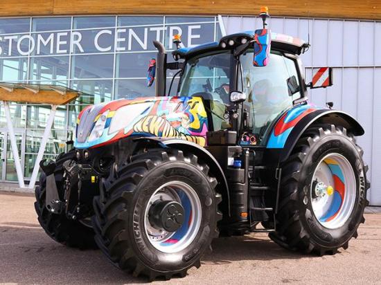 New Holland&#039;s one-off special edition T7.300 tractor was created in recognition of 60 years of production at its Basildon, England, factory. CNH Centro Stile did the paint, the colors and patterns a tribute to "Swinging &#039;60s" London, with psychedelic shapes and colors of blue, yellow, maroon and pink around New Holland&#039;s distinctive leaf logo in bright yellow on the hood. (Photo courtesy of New Holland)