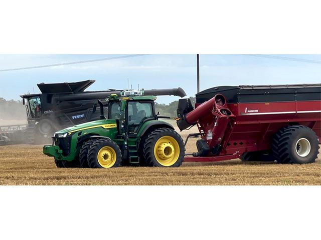 AGCO is demonstrating its autonomous tractor and grain cart system ahead of its rollout for 2025. It expects to soon field a tech solution giving combine operators the ability to manage more than one automated cart at a time. (DTN photo by Dan Miller)