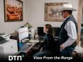 Alyssa Copeland and her father-in-law Cliff Copeland work together on herd records on the family's cattle operation in Nara Visa, New Mexico. (Photo by Heidi Anderson)