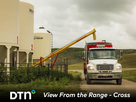 Malcolm Cross fills the feed truck with pellets used to feed cattle throughout the year at Cross Cattle Company in Alberta, Canada. (Photo courtesy of Certified Angus Beef)