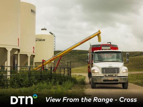 Malcolm Cross fills the feed truck with pellets used to feed cattle throughout the year at Cross Cattle Company in Alberta, Canada. (Photo courtesy of Certified Angus Beef)