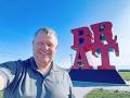 There&#039;s some controversy about whether the BRAT sculpture at the Johnsonville brat company&#039;s headquarters is actually the work of famed artist Robert Indiana, who crafted the similarly styled and much more famous "LOVE." There was no doubt I was going to take a picture with it, though.(DTN photo by Joel Reichenberger)
