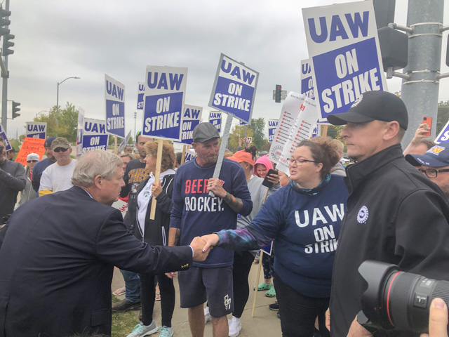 Agriculture Secretary Tom Vilsack took time during a trip to Ankeny, Iowa, to visit striking Deere and Co. workers at the plant there. Deere&#039;s workers went on strike last week over health care and retirement demands in contract talks with Deere. (DTN photo by Chris Clayton)