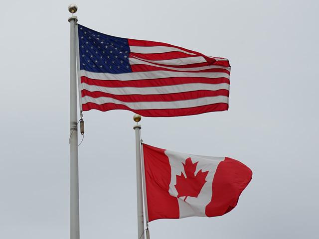 A U.S. and Canadian flag fly together. The U.S., Canada and Mexico met last week at the 35th Tri-National Agricultural Accord in Calgary, Alberta, as trade officials from the three countries also gathered at the G20 Trade Ministerial in Milwaukee, Wisconsin. (DTN photo by Jake Zajkowski)