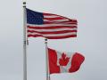 A U.S. and Canadian flag fly together. The U.S., Canada and Mexico met last week at the 35th Tri-National Agricultural Accord in Calgary, Alberta, as trade officials from the three countries also gathered at the G20 Trade Ministerial in Milwaukee, Wisconsin. (DTN photo by Jake Zajkowski)