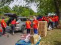 Volunteers and staff from Harvesters -- The Community Food Network in the Kansas City metro area load food boxes into vehicles during the pandemic. The food bank and others that serve states such as Iowa, Kansas, Missouri and Nebraska all say they are already seeing higher demand for charitable food that would only grow if SNAP cuts are implemented. (Photo courtesy of Harvesters -- The Community Food Network)