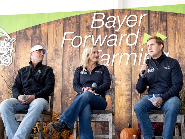 From left, Alan and Sara Mohr, who operate Cornfed Farms near Ladora, Iowa, listen as Brian Naber, Bayer&#039;s head of crop science for North America and Australia/New Zealand, discusses the company&#039;s ForwardFarming initiative. The Iowa farm is the first in the Midwest to participate in ForwardFarming. (DTN photo by Jason Jenkins)