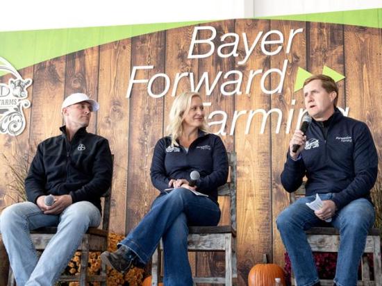 From left, Alan and Sara Mohr, who operate Cornfed Farms near Ladora, Iowa, listen as Brian Naber, Bayer&#039;s head of crop science for North America and Australia/New Zealand, discusses the company&#039;s ForwardFarming initiative. The Iowa farm is the first in the Midwest to participate in ForwardFarming. (DTN photo by Jason Jenkins)