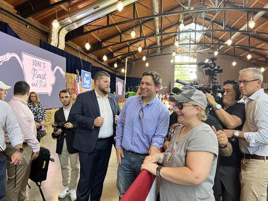 Florida Gov. Ron DeSantis did some retail politicking Saturday with Iowans before he spoke at a GOP rally hosted by Iowa Sen. Joni Ernst. DeSantis is considered the closest early challenger to former President Donald Trump for the GOP nomination next year. Eight potential candidates spoke at the rally. (DTN photo by Chris Clayton) 