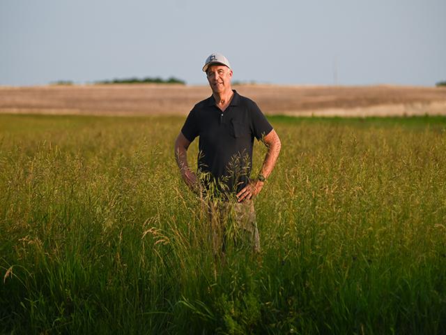Doug Doughty stands in his field in early June in Livingston County, Missouri. Doughty and his wife, Barb, own roughly 1,200 acres of land, some of which is property that has been in Doughty&#039;s family for over 185 years. (Photo by Maya Bell for the Ag &amp; Water Desk 2024)