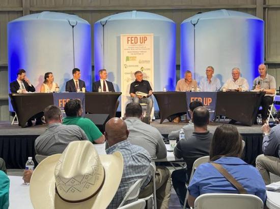 With fertilizer tanks as a backdrop, more than 100 farmers representing several major corn-producing states held a field hearing Thursday with the chairman of the Federal Trade Commission. The FTC chairman announced his agency has launched an investigation into anticompetitive practices by fertilizer companies. (DTN photo by Chris Clayton) 