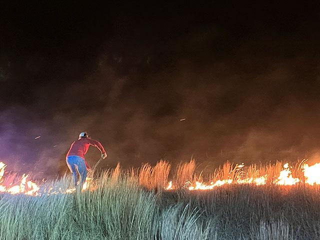 Sara Cover fights the Ashby Fire on their ranch in Grant County, Nebraska, on March 26. (Photo courtesy of Kathy Cover)