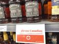 A bottle of whiskey sits on a shelf in a Winnipeg, Manitoba, Canada, store. A long list of liquor, fermented beverages, whey and molasses was ordered Tuesday to be "excluded from importation" as retaliation in a U.S.-Canada trade battle that escalated after trade talks failed in August. (DTN photo by Chris Clayton)