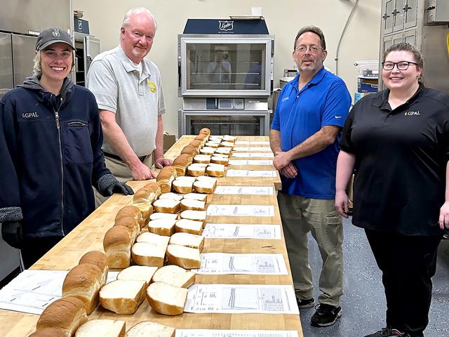 Bread baked from wheat grown by winners in the 2025 National Wheat Yield Contest was evaluated at the Great Plains Analytical Laboratory (GPAL) in Kansas City, Missouri. Pictured, from left, is Seadon Rolston, Brian Walker with the National Wheat Foundation, Todd Lowenstein and Lacey Schmidt. (Photo courtesy of Brian Walker)