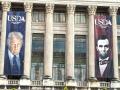 Banners of President Donald Trump and former President Abraham Lincoln were added to the front of USDA&#039;s headquarters building in Washington, D.C., last month. Politico reported Wednesday that USDA delayed the release of a quarterly trade outlook report and removed the analysis from Economic Research Service (ERS) economists because it showed a slightly widening trade deficit for FY 2025. (Photo courtesy of Jerry Hagstrom)
