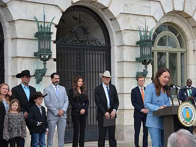 With South Dakota ranchers Heather and Charles Maude to her left with their children, Agriculture Secretary Brooke Rollins talks about the Biden administration charging the couple with federal theft over a land dispute with the U.S. Forest Service. Rollins announced the charges had been dropped. (DTN photo by Chris Clayton)