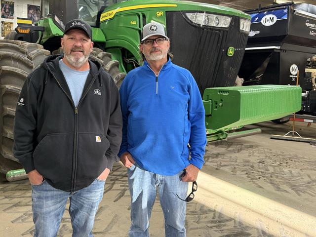 Kenny Rathjen, left, and Monte Simerly earned top honors in the 2024 National Sorghum Yield Contest. Their entry from K&amp;M Farms in Dalhart, Texas, was named the contest&#039;s Bin Buster winner with the overall top yield of 240.01 bushels per acre. (Photo courtesy of Kenny Rathjen)