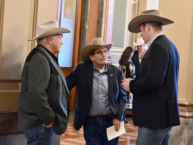 Iowa cattlemen Brad Balsley, Bob Noble and Craig Moss discuss policy issues during the Cattlemen at the Capitol event on Feb. 26, 2025, at the Iowa Capitol in Des Moines. (DTN/Progressive Farmer photo by Jennifer Carrico)