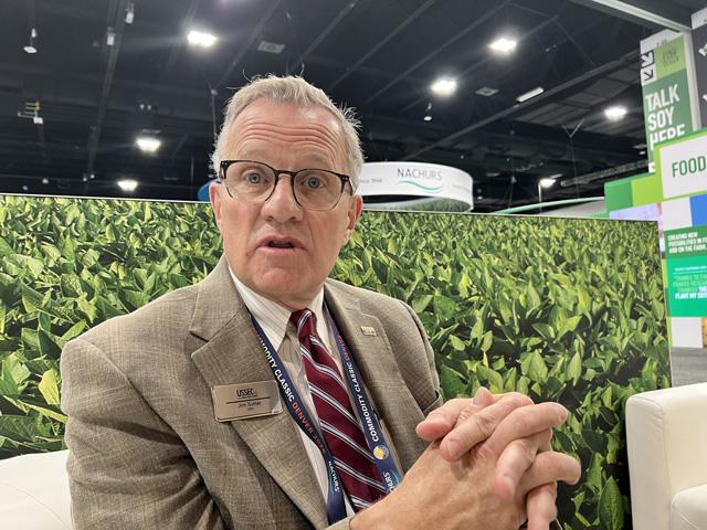 Jim Sutter, CEO of the U.S. Soybean Export Council (USSEC), talks about trade and tariffs on the floor of Commodity Classic in Denver. Sutter said as much as 60% of soybeans, meal and soy oil produced in the U.S. end up exported. Mexico is a top three market for soy products, while Canada is in the top 10 markets for soybeans. (DTN photo by Chris Clayton)