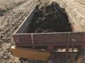 It is the beginning of spring when tractors return to the field to spread manure. (DTN file photo by Russ Quinn)