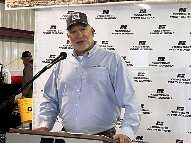 Mark McHargue, president of Nebraska Farm Bureau, talks about the farm economy and policy issues at the Husker Harvest Days farm show near Grand Island, Neb. McHargue raised concerns that state lawmakers could eliminate the sales tax exemption on farm inputs to deal with a budget shortfall. (DTN photo by Chris Clayton)