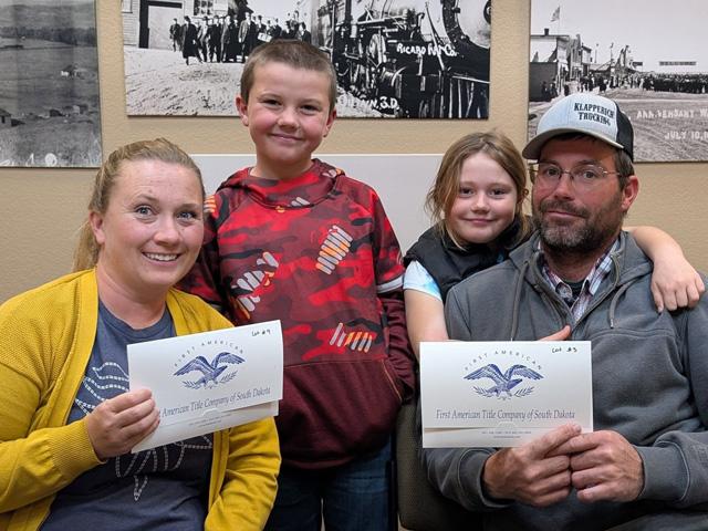 Heather and Charles Maude, with their children Lyle and Kennedy, after the family purchased land from the U.S. Forest Service through the Small Tracts Act. (Photo courtesy of the Maude family)