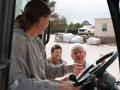 Fertilizer loadout operator Danielle Morgan receives instructions from Mike Carroll, owner of Meherrin Fertilizer in Four Oaks, North Carolina, while sales manager Andrew Carroll looks on. (Photo courtesy of Meherrin Fertilizer)