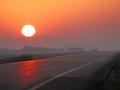 Smoke from wildfires can create beautiful sunrises and sunsets but also produce hazardous air pollution that has been affecting Canada as well as the United States. Just as hazy at times can be the crop acreage and production estimates. (DTN photo by Elaine Shein)