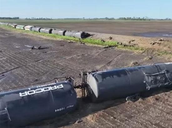 Storm Chaser Aaron Rigsby used a drone to videotape the long line of railway cars knocked over by a tornado near Enderlin, North Dakota, as well as some of the cars that were pushed or tossed into a field on Friday night. (Screenshot of Aaron Rigsby video)