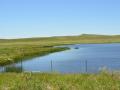 A wetlands pond off a highway in North Dakota. EPA is again moving to rewrite the waters of the U.S. (WOTUS) rule to align more closely with the 2023 ruling in the Sackett case. (DTN file photo) 