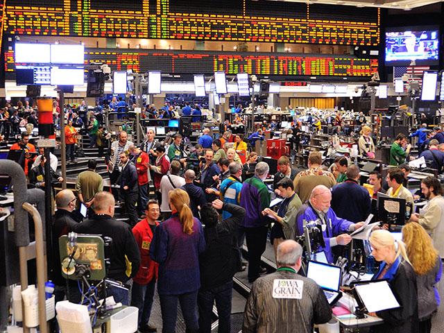An image of the CME grain trading floor in Chicago in 2014. The old trading floors are gone, but the futures industry is now dealing with pressure from new markets that want physical commodities such as oil to be traded 24 hours a day, seven days a week. Energy and agricultural industries that use futures to hedge risk oppose the idea. (DTN file photo by Jim Patrico)