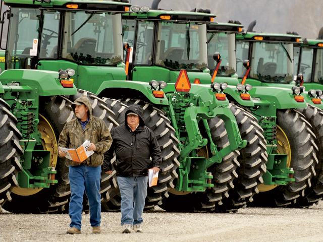 Before the first bid, potential buyers have a chance to walk the lot to see the machinery for sale first-hand. They can even climb into the cab for closer inspection. (Progressive Farmer image by Jim Patrico)