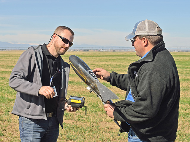 Without a license, pilots such as Jason Downing (left) and Trimble training specialist Wade Stewart could not legally fly the companyâ€™s unmanned aerial system, the UX5.