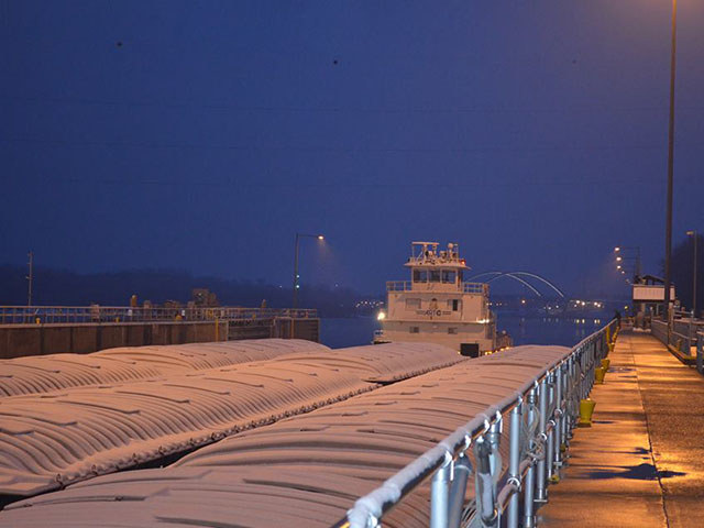The motor vessel New Dawn is shown as it moved through Lock and Dam 2, near Hastings, Minnesota, after breaking through Lake Pepin ice on March 25. (Photo courtesy USACE St. Paul District)