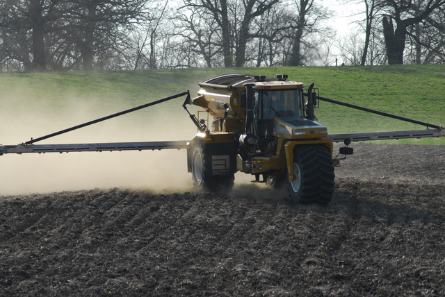 Dry fertilizer applicators went fast and furious this fall, but should they have waited until spring? (DTN photo by Jim Patrico)