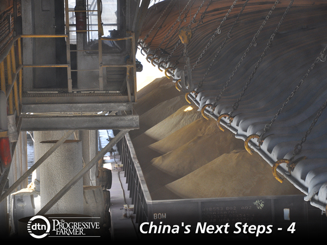 A barge on the Mississippi River is being prepped to load distillers dried grains onto an export ship. Ethanol and grain experts say the price of corn and DDGS is heavily influenced by the volume of DDGS being exported to China. (DTN photo by Chris Clayton)