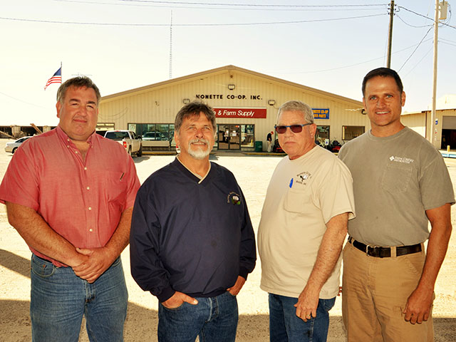Darin Owens, left, Dennis Gathright, Sam Wilson and Michael Mangrum , Monette Cooperative,  are smiling this spring as cotton acres return to the Buffalo Island region of Arkansas. (DTN photo by Elton Robinson)