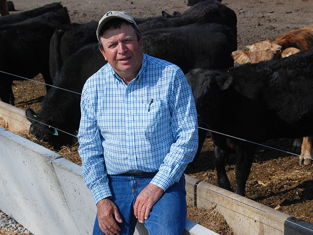 E. B. Harris uses a home blend of corn silage, cotton gin byproduct and hay as the ration he backgrounds calves on at his North Carolina farm. (DTN/Progressive Farmer photo by Boyd Kidwell)