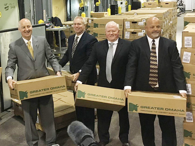 Nebraska Gov. Pete Ricketts and staff loading boxes of beef. (Photo courtesy of the Nebraska governor&#039;s office)