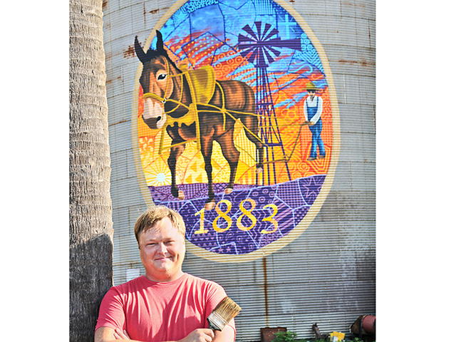 Chris Johnson creates historic agriculturally themed murals on old grain bins to beautify a small town in Georgia. (DTN/Progressive Farmer image by Becky Mills)