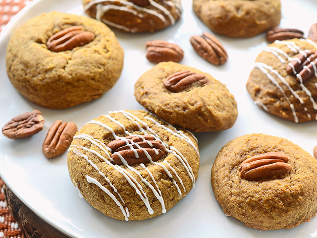 Soft, cakelike pumpkin cookies are topped with a pecan and drizzled with icing for extra sweetness. (DTN/Progressive Farmer image by Rachel Johnson)