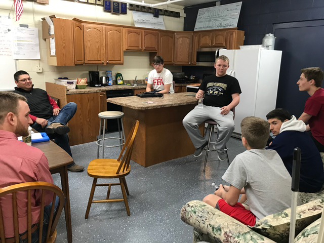 FFA students from York, Nebraska, chat with Mycogen commercial agronomist Craig Solomon, far left, and seed sales representative Matt Porter, second from left, in a kitchen they constructed over the summer. It&#039;s become a useful tool for the FFA program, as well as a popular hangout for the students. Students pictured are, from left, Chase Cotton, Max Kohmetscher, Cooper Koch, Carlos Munoz and Bryce Danielson. (Photo by Dave Vrbas)