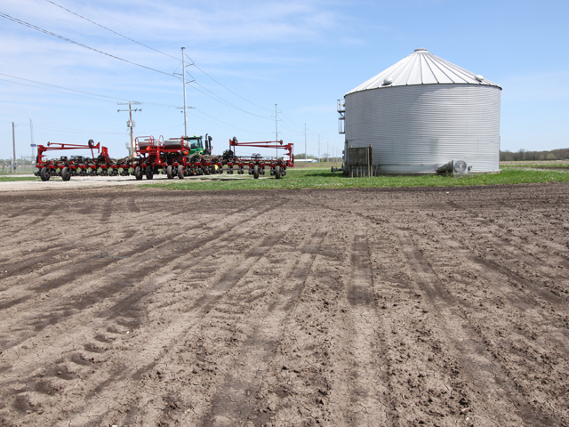 Planters across the country are stalled, as farmers wait for warmer, drier weather to plant corn. (DTN photo by Pamela Smith)