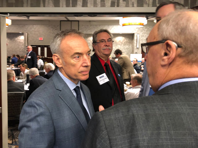 USDA Deputy Secretary Steve Censky (left) talks to farmers after addressing the Iowa Soybean Association in Ankeny, Iowa, on Thursday. (DTN photo by Chris Clayton)
