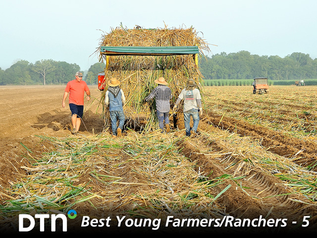 Louisiana farmer Bobby Morris (left) produces sugarcane, one of the most labor-intensive crops to plant. On Morris Farms, planting is done by hand. Cane is laid down into furrows by workers who plant up to 7 acres per day. One acre of seed cane plants 7 acres of sugarcane. (DTN/The Progressive Farmer photo by Jim Patrico)