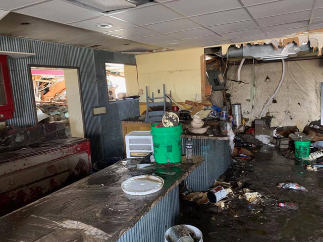 One major problem after the floodwaters are gone is microbial growth on surfaces in buildings. This can lead to various human issues, including general discomfort, irritated mucous membranes and irritation to the nervous system. People should wear personal protective equipment when cleaning up. (Photo courtesy of Nebraska governor&#039;s office)