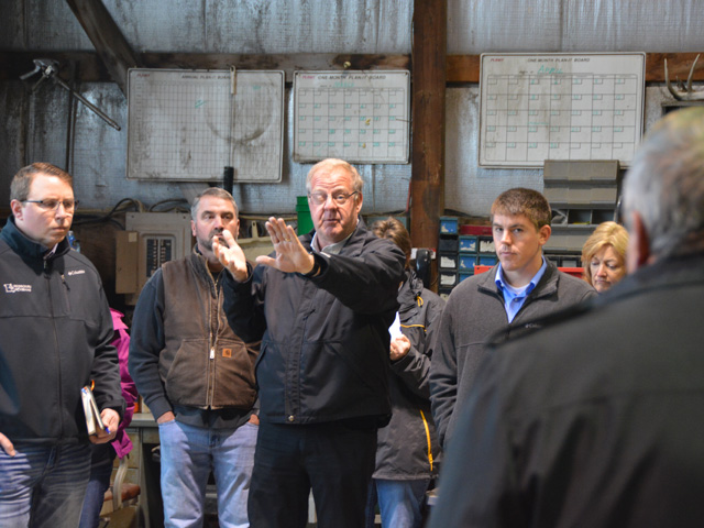 Tom Waters, chairman of the Missouri Levee and Drainage District Association, explains some of the levee issues along the Missouri River to USDA Undersecretary for Farm Production Bill Northey at a meeting on a flooded farm near Watson, Missouri, on Thursday. (DTN photo by Chris Clayton) 