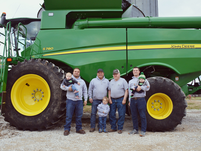 Four generations of family care for Wallis Farms. From left to right, son-in-law Brad Winter holds son, Ben Winter; Scott Wallis, Bob Wallis, J.R. Wallis holds Bobby Joe Wallis. Henry Winter in the front row. (Photo courtesy of Nikki Wallis)
