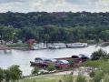 Empty barges are parked alongside the Mississippi River in downtown St. Paul, Minnesota, in late summer, Image by Mary Kennedy